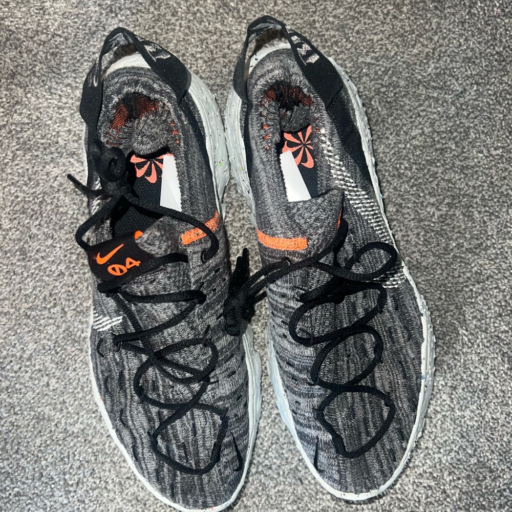 Nike Black and Gray Shoes with Orange Highlights